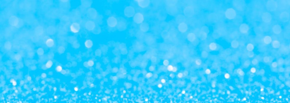 sparkles of Blue glitter abstract background. Copy space. banner
