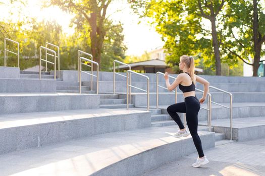 Sport and Fitness. Fit Woman Running up stairs Summer Sunny Morning Caucasian Athletic Female Jogging Outdoor Cardio Training Active Healthy Lifestyle Dressed Black Sportswear Motivation Concept