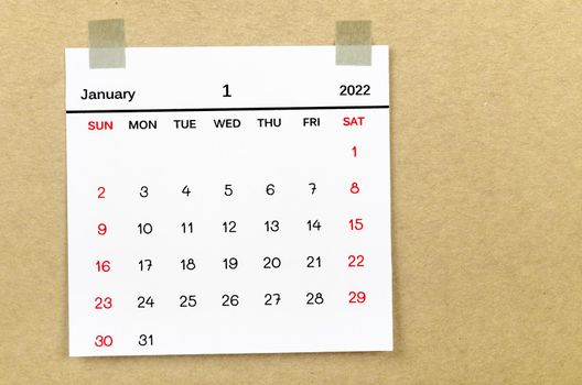 The January 2022 calencar on brown background.