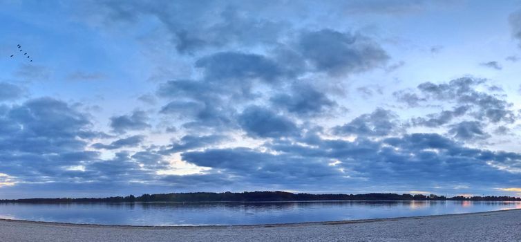 Beautiful high resolution panorama of a lake with a stunning sky