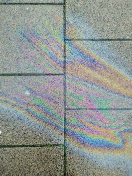 Colorful fuel and oil on the ground showing enviromental pollution