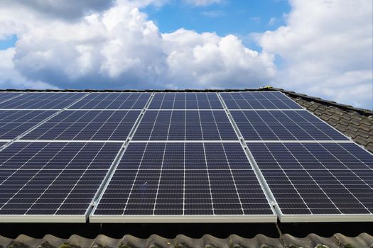 Solar panels producing clean energy on a roof of a residential house