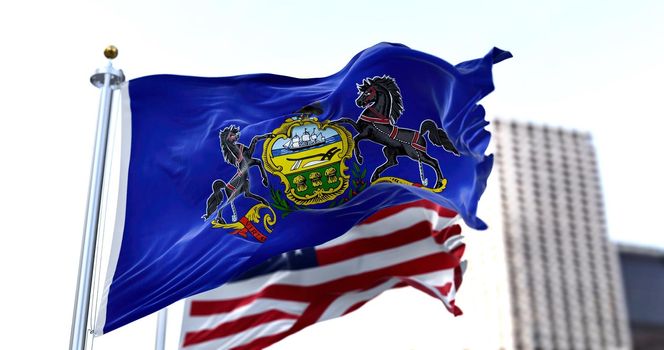 the flag of the US state of Pennsylvania waving in the wind with the American flag blurred in the background. Pennsylvania was admitted to the Union on December 12, 1787 as 2nd state