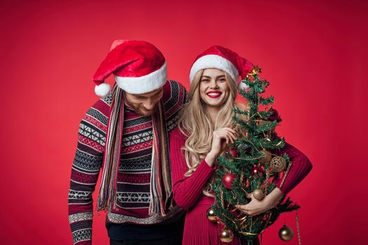 portrait of married couple christmas holiday red background. High quality photo