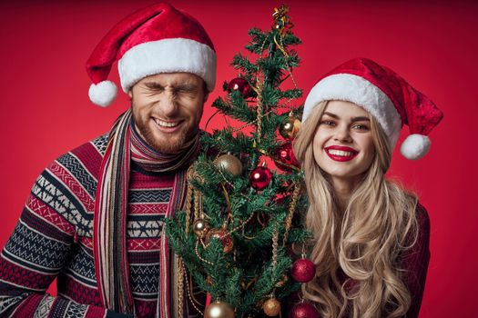 merry married couple celebrate christmas new year red background. High quality photo