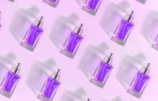Pattern of Transparent perfume bottle with metallic top lying on pink violet background ib the sunlight. High-quality minimalistic photo. Stylish perfumery picture with space for text