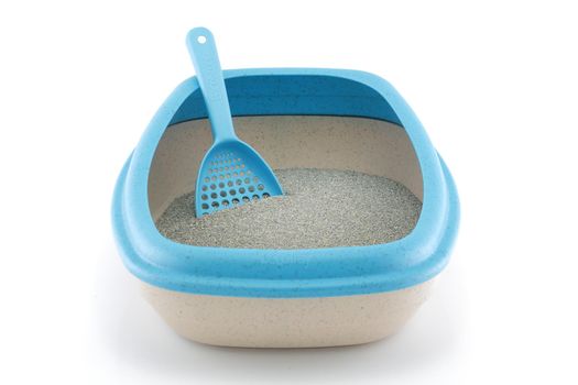 A front view of a cat litter tray with scoop on white