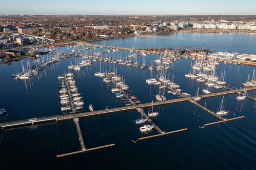 Copenhagen, Denmark - January 06, 2022: Aerial drone view of Svanemolle sailboat Harbor