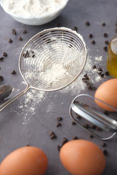 chicken eggs and baking ingredients on a wooden board,