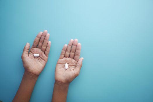 close up of medical pills on palm of child hand ,