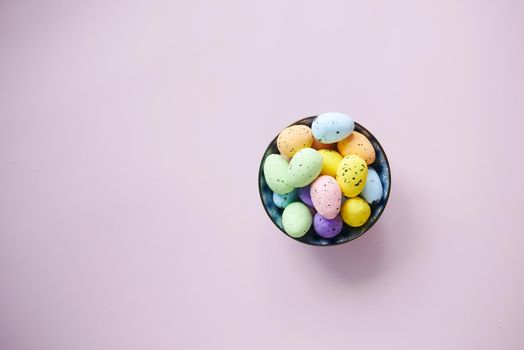 easter concept with egg on pink background..