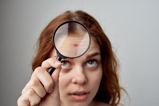 beautiful woman with a pimple on the face isolated background. High quality photo