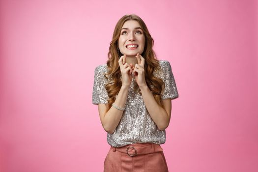 Girl prays god hopefully intense look sky cross fingers good luck nervously worried parents know throw party, standing anxious faithfully supplicating, dreaming wish come true, pink background.