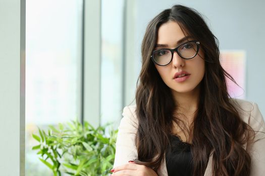 Beautiful smiling girl at workplace. Successful career in business concept