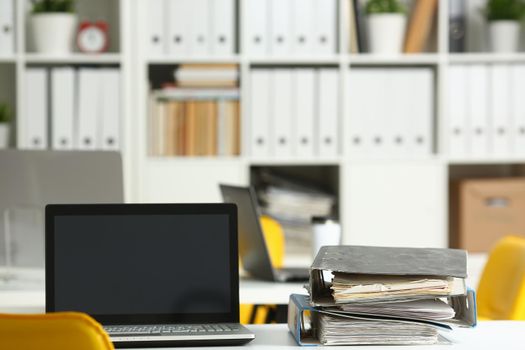 Empty workplace folders with documents in office on table closeup. Planning work day concept