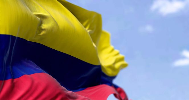 Detailed close up of the national flag of Colombia waving in the wind on a clear day. Democracy and politics. South american country. Selective focus.