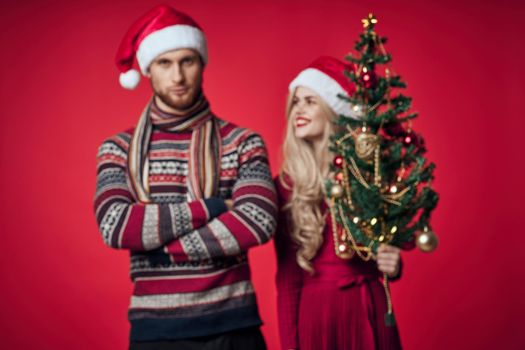 cute married couple in new year clothes holiday christmas studio. High quality photo