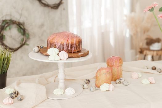 A set table for the celebration of Easter. Cakes and quail eggs on the Easter table. Happy Easter.