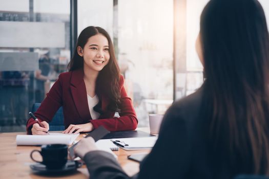 During a job interview, Woman in a suit and gives a presentation about herself