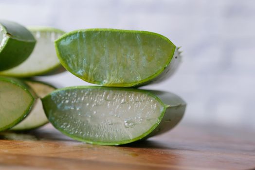 Close-up Fresh Aloe vera sliced on a chopping board.