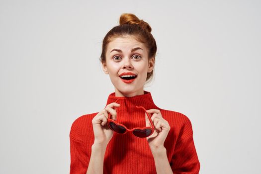 fashionable woman in a red sweater isolated background. High quality photo