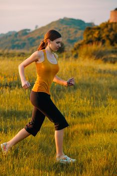 Beautiful anf athletic woman making some morning exercise