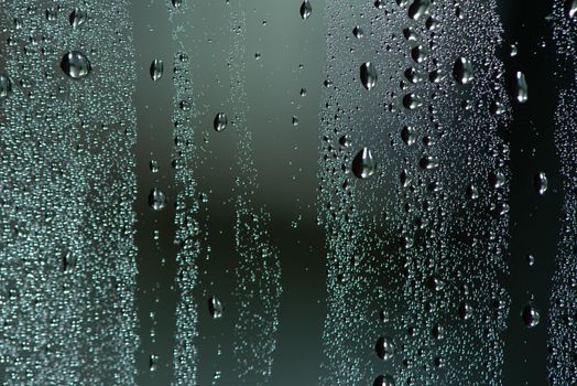 Natural water drops on glass.