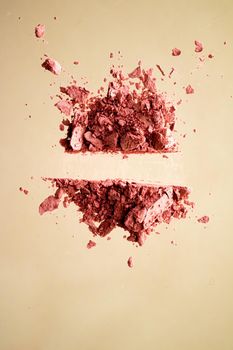 Crushed cosmetics, mineral organic eyeshadow, blush and cosmetic powder isolated on golden background, makeup and beauty banner, flatlay design.