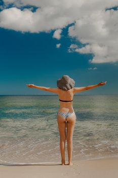 Beautiful woman enjoying a day at the beach