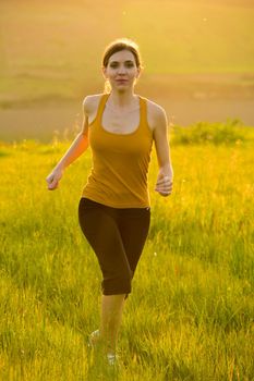 Beautiful anf athletic woman making some morning exercise