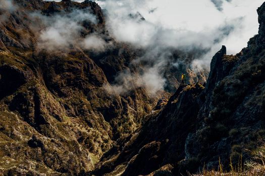 Backpack woman exploring the montains in Madeira Island, Portugal
