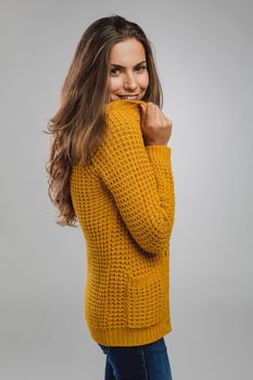 Shot of a beautiful young woman over a gray background