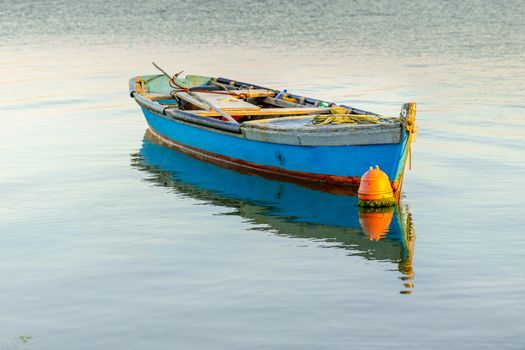 Beautiful old fishing boats resting on the lake