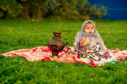 little girl in a Russian costume. Little girl in traditional Russian folk costume. Russian children. . High quality photo