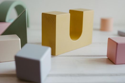 Children's wooden cubes. The concept of zero waste. Logical thinking. Wooden colorful blocks and cubes. Toys made of natural wood.