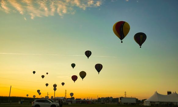 View of Many Hot Air Balloons Getting Ready to Take Off On An Early Morning Balloon Festival