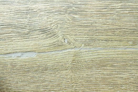 Wood texture. Wooden board close up. The cracks are deep. Laminate flooring. Tree rings in a cut.