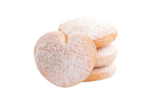 Sweet heart shaped butter cookies sprinkled with powdered sugar isolated on white background. Popular pastries