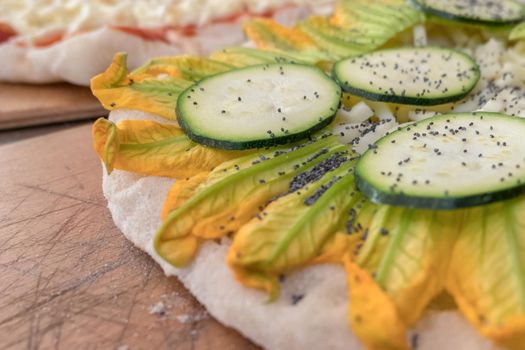 Vegetarian pizza with zucchini and courgette flowers.