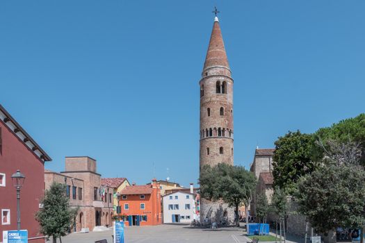 View of Vescovado Square and cathedral bell tower. Caorle (VE), ITALY - July 29, 2021.