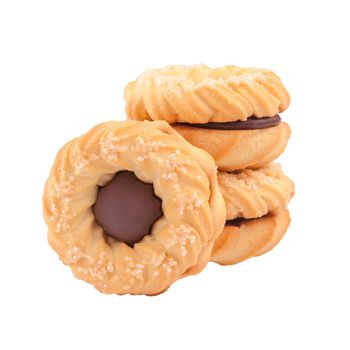 Tender crispy ring shaped butter shortbread sandwich biscuits with chocolate cream filling sprinkled with sugar stacked isolated on white background