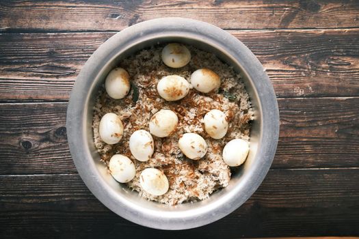 chicken biryani meal in a bowl on table