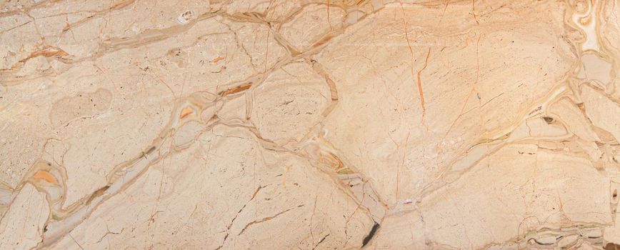 beige color polished natural marble with natural streaks. Used for wall and floor tiles.