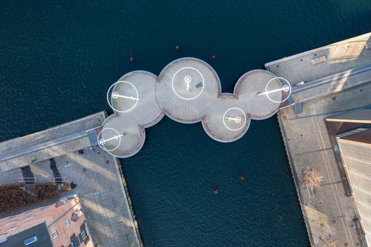 Copenhagen, Denmark - January 14, 2022: Aerial drone view of the modern Circle Bridge, a pedestrian bridge in the harbour area.