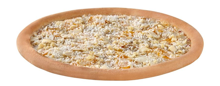 Closeup of delicious sweet pizza on condensed milk with ripe banana and peach slices garnished coconut shavings and almond flakes isolated on white background