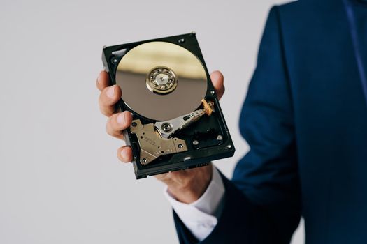 computer hard drive in hands technology close-up. High quality photo