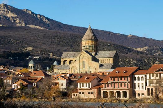 Mtskheta, Georgia - January 14, 2022: Old famous town in Georgia, Mtskheta. Old houses travel destination. Svetitshkoveli cathedral and church view.