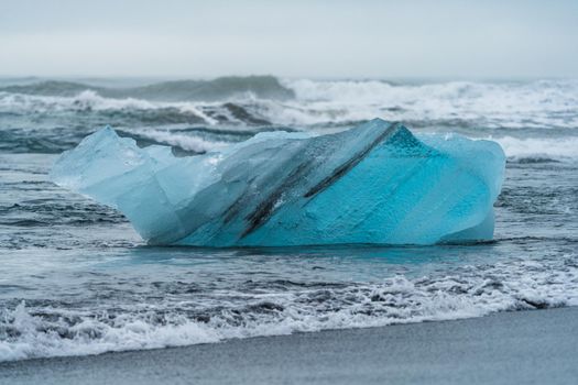 Spectacular deep blue iceberg in diamond beach, Iceland