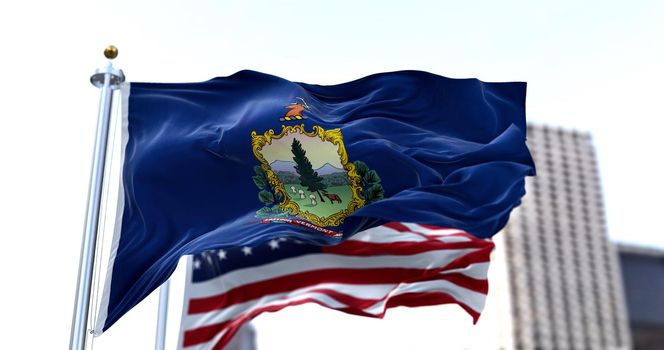 the flag of the US state of Vermont waving in the wind with the American flag blurred in the background. Vermont was admitted to the Union on March 4, 1791 as 14th state