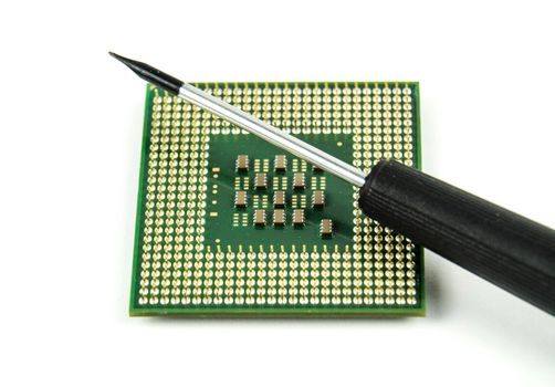Old and vintage micro processor and screwdriver on white background